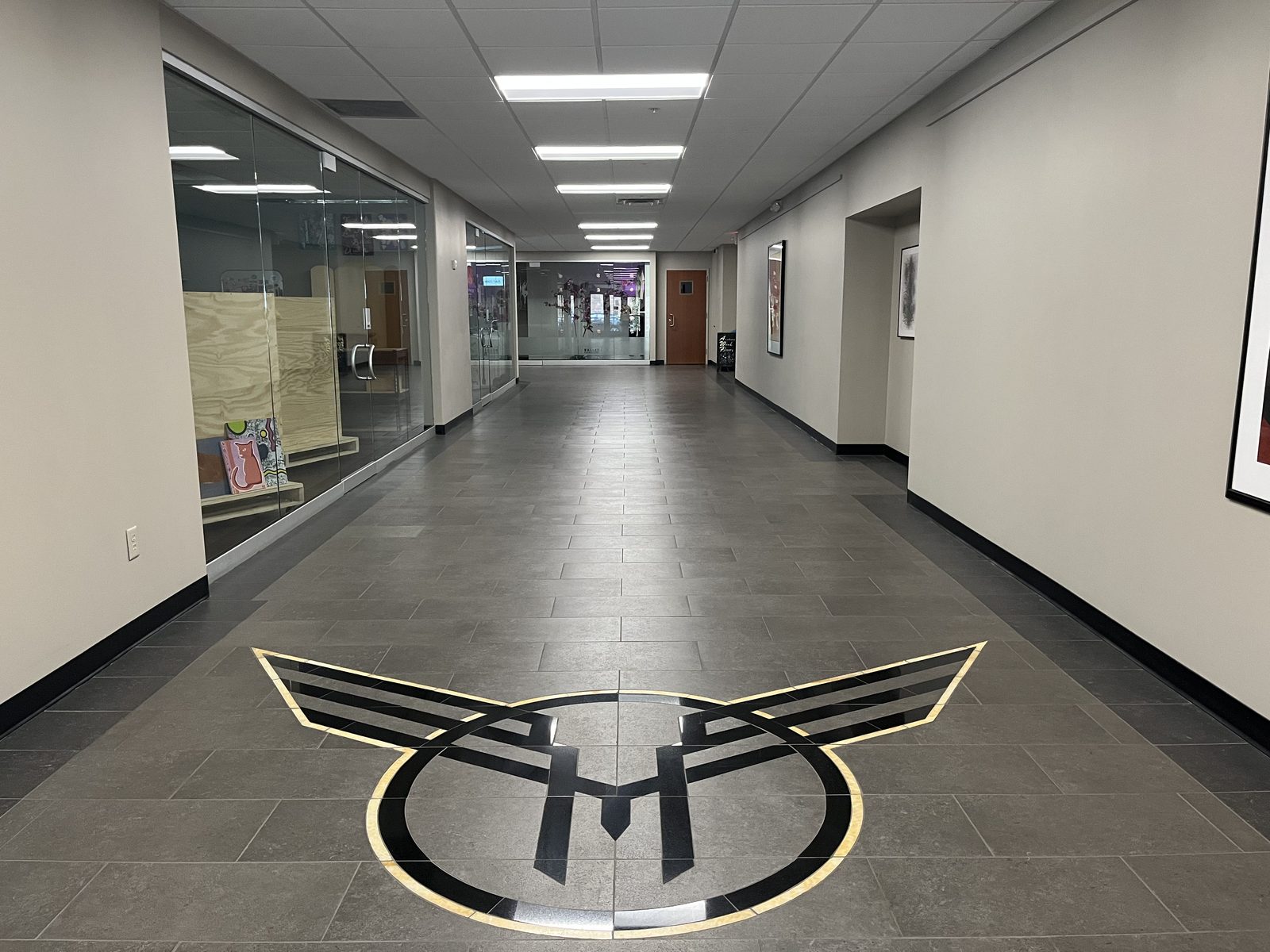 Commercial hallway with freshly finished floors โ CT Cleaners janitorial service